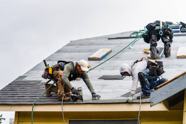Professional Gutter Installation technician working in Iola, KS